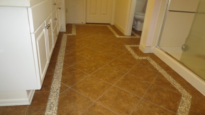 diagonal tile floor with pebble border in Sammamish Washington